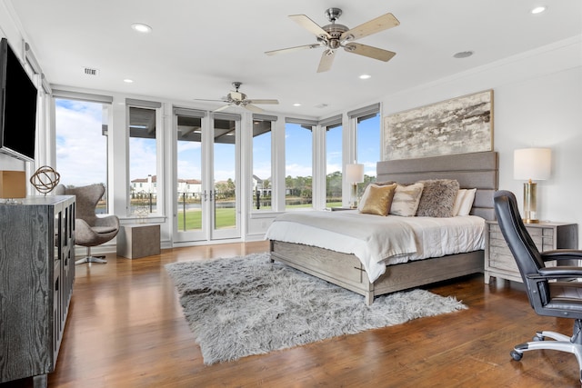 bedroom featuring french doors, crown molding, dark hardwood / wood-style flooring, access to exterior, and ceiling fan