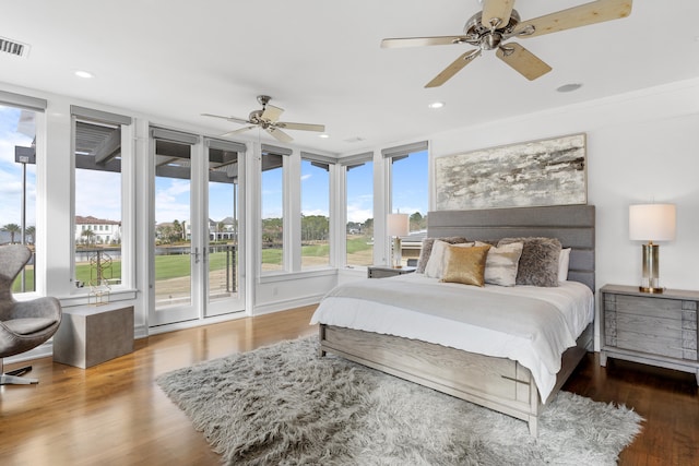 bedroom with ceiling fan, dark hardwood / wood-style flooring, and access to outside