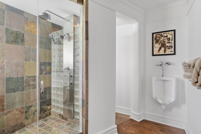 bathroom featuring hardwood / wood-style floors and an enclosed shower