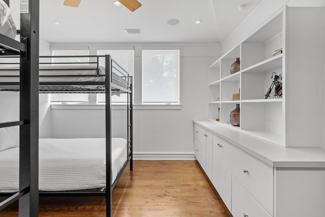 unfurnished bedroom featuring light hardwood / wood-style floors and ceiling fan