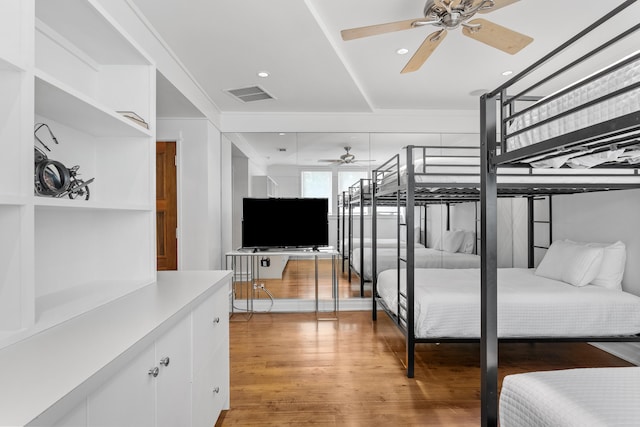 bedroom featuring light hardwood / wood-style floors and ceiling fan