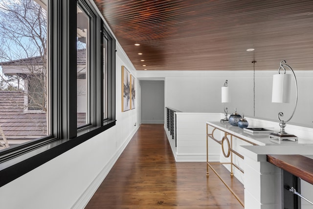 hallway with wooden ceiling and dark hardwood / wood-style floors