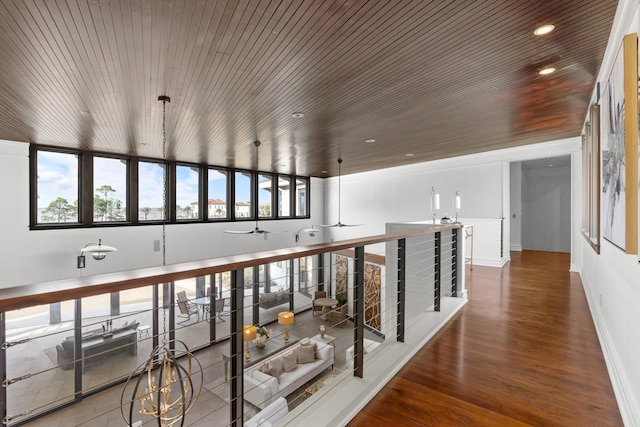 hall with wooden ceiling and hardwood / wood-style flooring