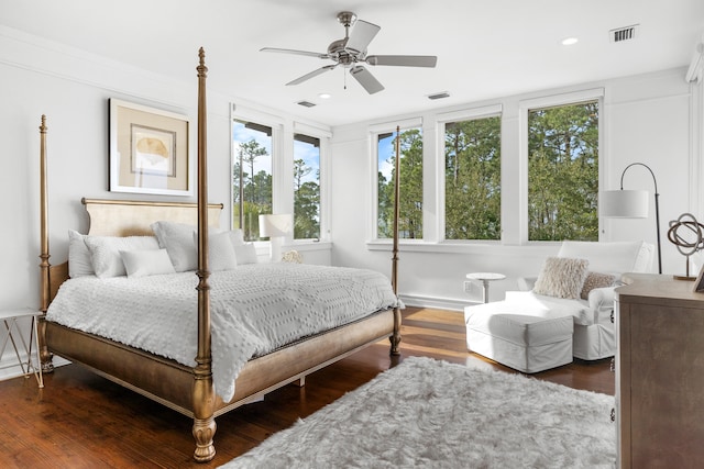 bedroom with dark wood-type flooring and ceiling fan