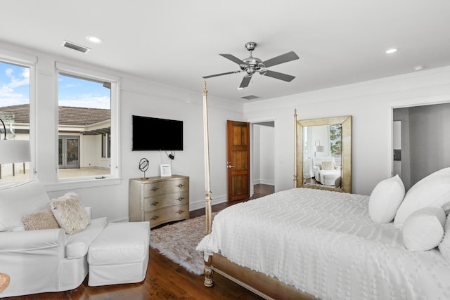 bedroom with ceiling fan and dark hardwood / wood-style floors