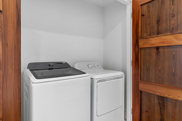 laundry room featuring washing machine and clothes dryer