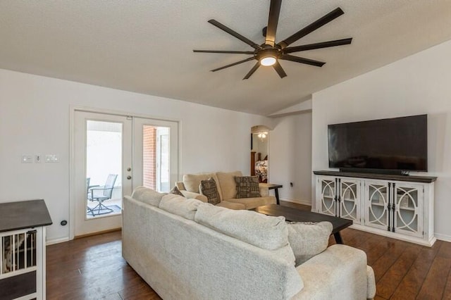 living room with french doors, lofted ceiling, ceiling fan, and dark wood-type flooring