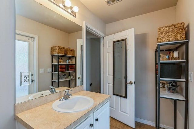 bathroom featuring tile patterned floors and vanity