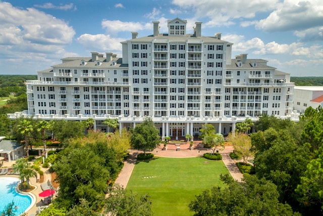 view of building exterior featuring a community pool