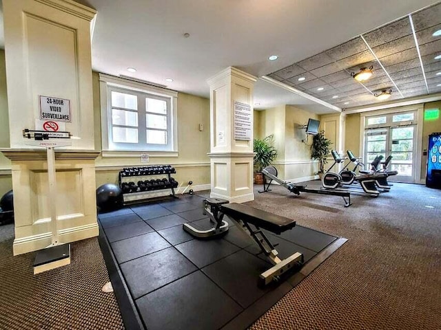 gym featuring dark colored carpet