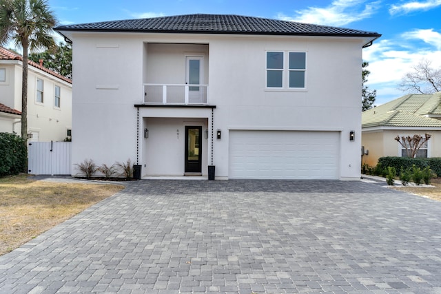 view of front of house with a balcony and a garage