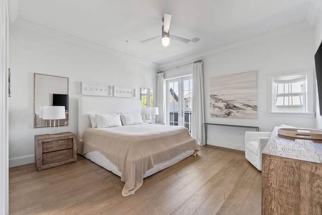 bedroom with light hardwood / wood-style flooring, ceiling fan, and ornamental molding