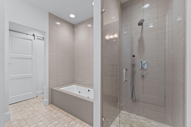 bathroom with tile flooring and independent shower and bath