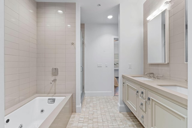 bathroom with tile flooring, tile walls, double sink, and vanity with extensive cabinet space