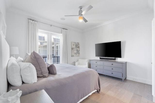 bedroom featuring crown molding, light hardwood / wood-style flooring, and ceiling fan