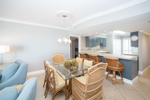 dining room featuring ornamental molding, a chandelier, baseboards, and light tile patterned floors