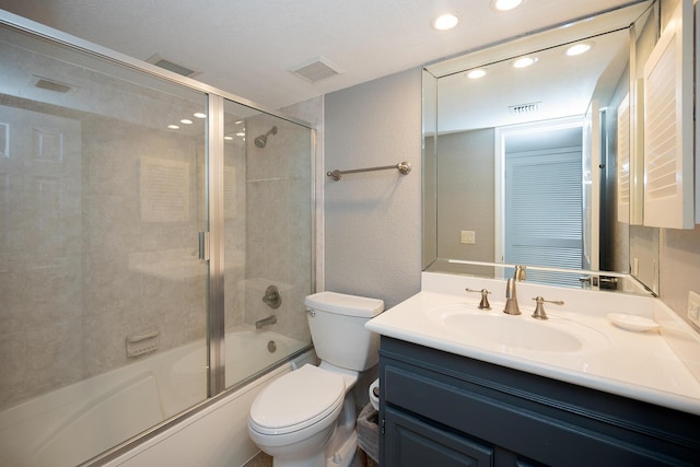 full bath with toilet, shower / bath combination with glass door, and visible vents