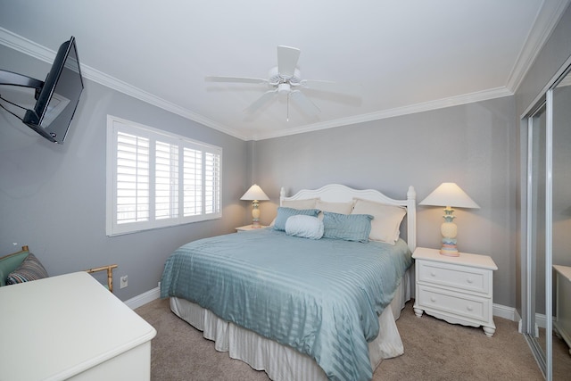 bedroom with light carpet, a closet, baseboards, and crown molding