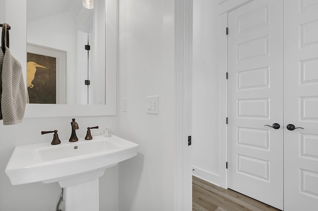 bathroom featuring sink and hardwood / wood-style flooring