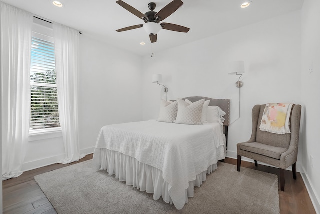 bedroom featuring ceiling fan and hardwood / wood-style floors