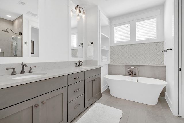 bathroom featuring tile floors and double sink vanity