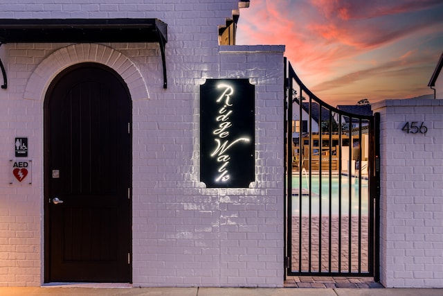 view of gate at dusk