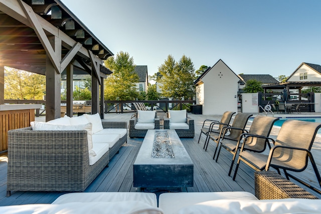 view of patio featuring an outdoor living space and a pool side deck