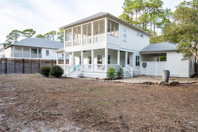 rear view of property featuring a porch