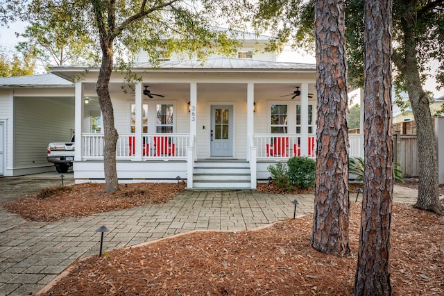 bungalow-style home featuring ceiling fan and covered porch