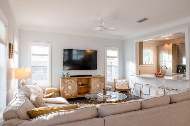 living room featuring crown molding, dark hardwood / wood-style flooring, and ceiling fan