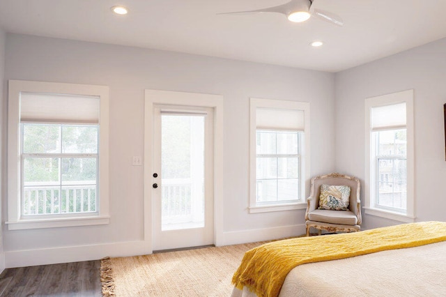 bedroom with light hardwood / wood-style flooring, ceiling fan, and access to exterior