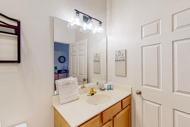 bathroom featuring vanity with extensive cabinet space