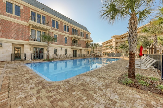 view of swimming pool with a patio