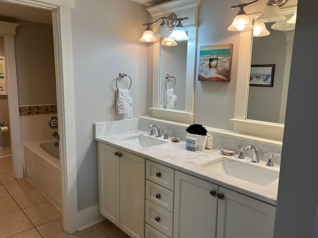 bathroom featuring a tub to relax in, tile patterned flooring, a sink, and double vanity