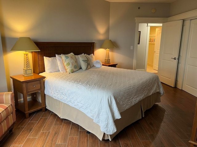 bedroom with wood finish floors