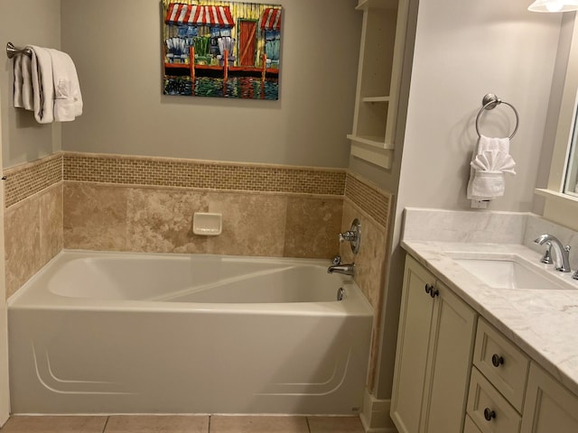 bathroom featuring a bath, vanity, and tile patterned floors