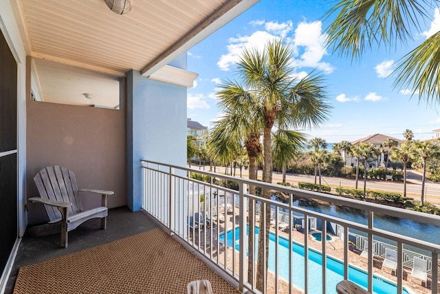 balcony featuring a community pool