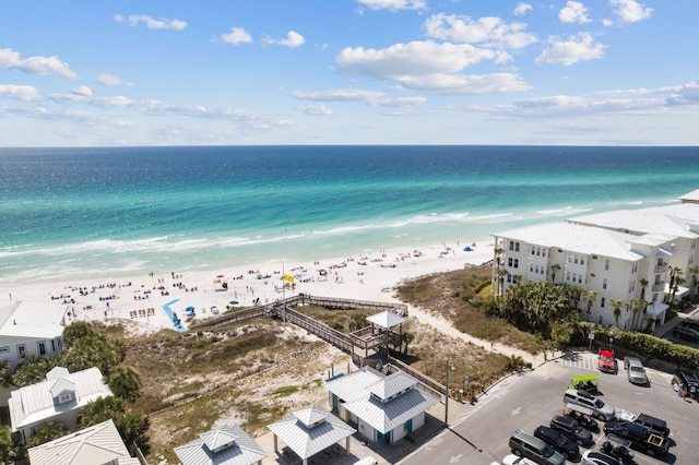 aerial view featuring a water view and a beach view