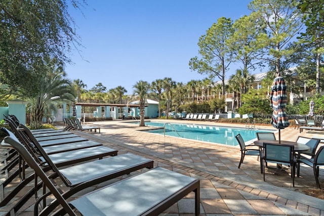 view of swimming pool featuring a patio area