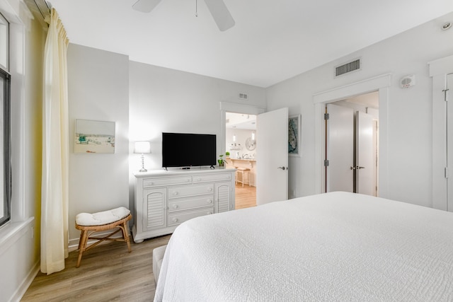 bedroom featuring light hardwood / wood-style flooring and ceiling fan