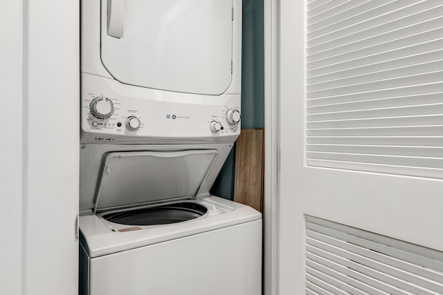 laundry room with stacked washer and clothes dryer