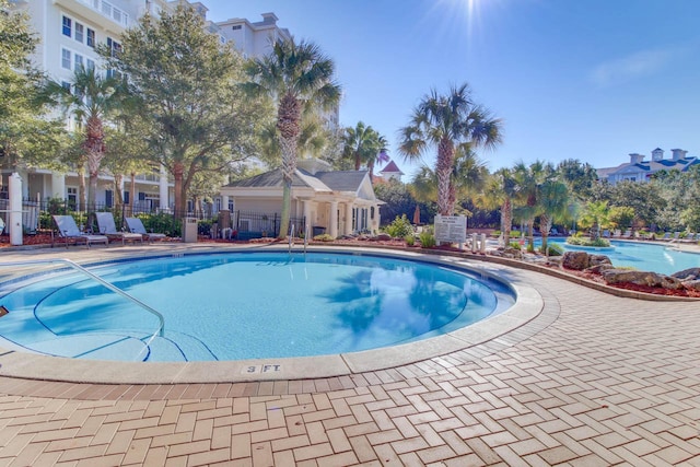 view of swimming pool featuring a patio