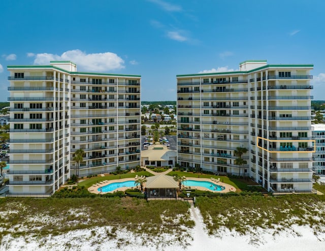 view of property featuring a community pool