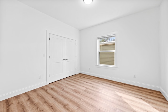 spare room with light hardwood / wood-style floors