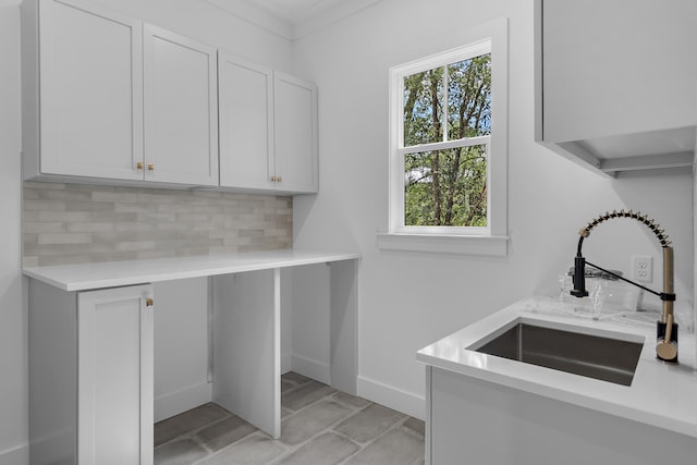 washroom featuring ornamental molding, light tile patterned floors, and sink