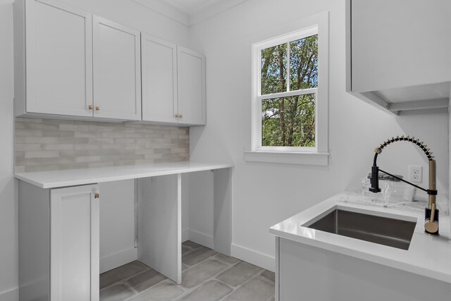112 S Magnolia Beach Way, Santa Rosa Beach, FL 32459 - laundry room featuring a sink and baseboards