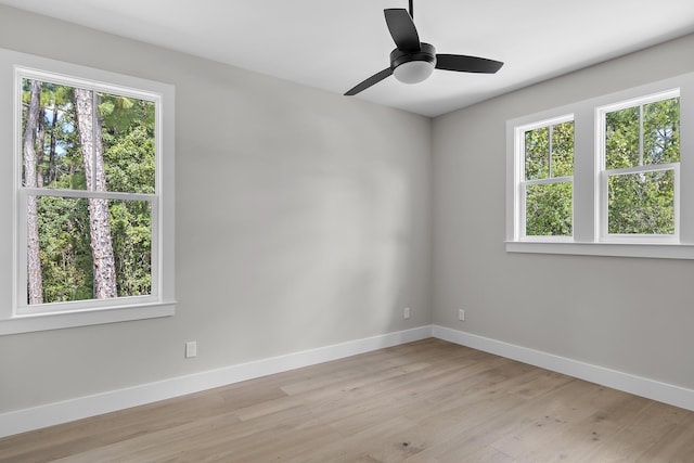 112 S Magnolia Beach Way, Santa Rosa Beach, FL 32459 - empty room featuring healthy amount of natural light, baseboards, light wood-style flooring, and a ceiling fan