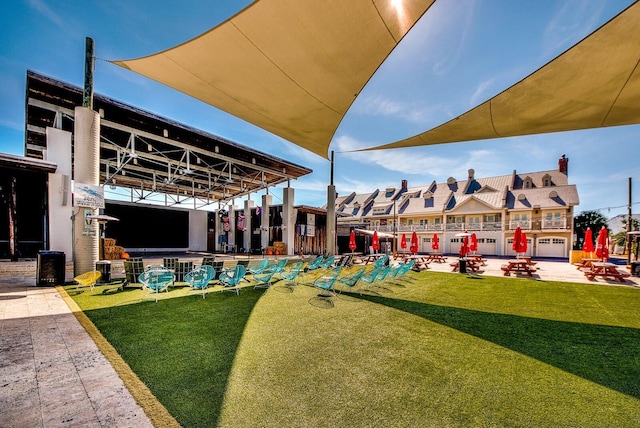 view of home's community with an outdoor fire pit