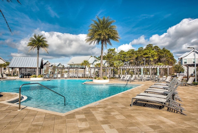 view of swimming pool featuring a patio area