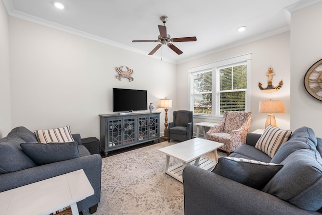 living room with ornamental molding and ceiling fan